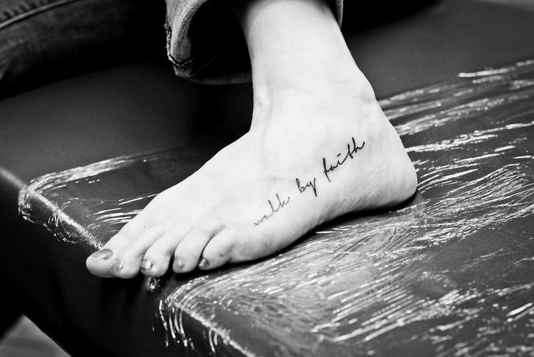 voet tatoeage tekst