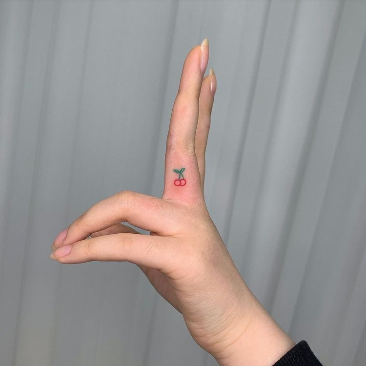 cherry tattoo hand finger