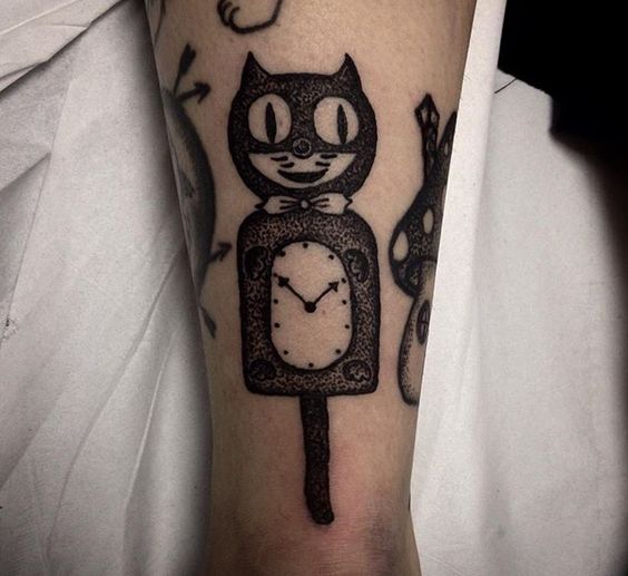 Kit-cat tattoo